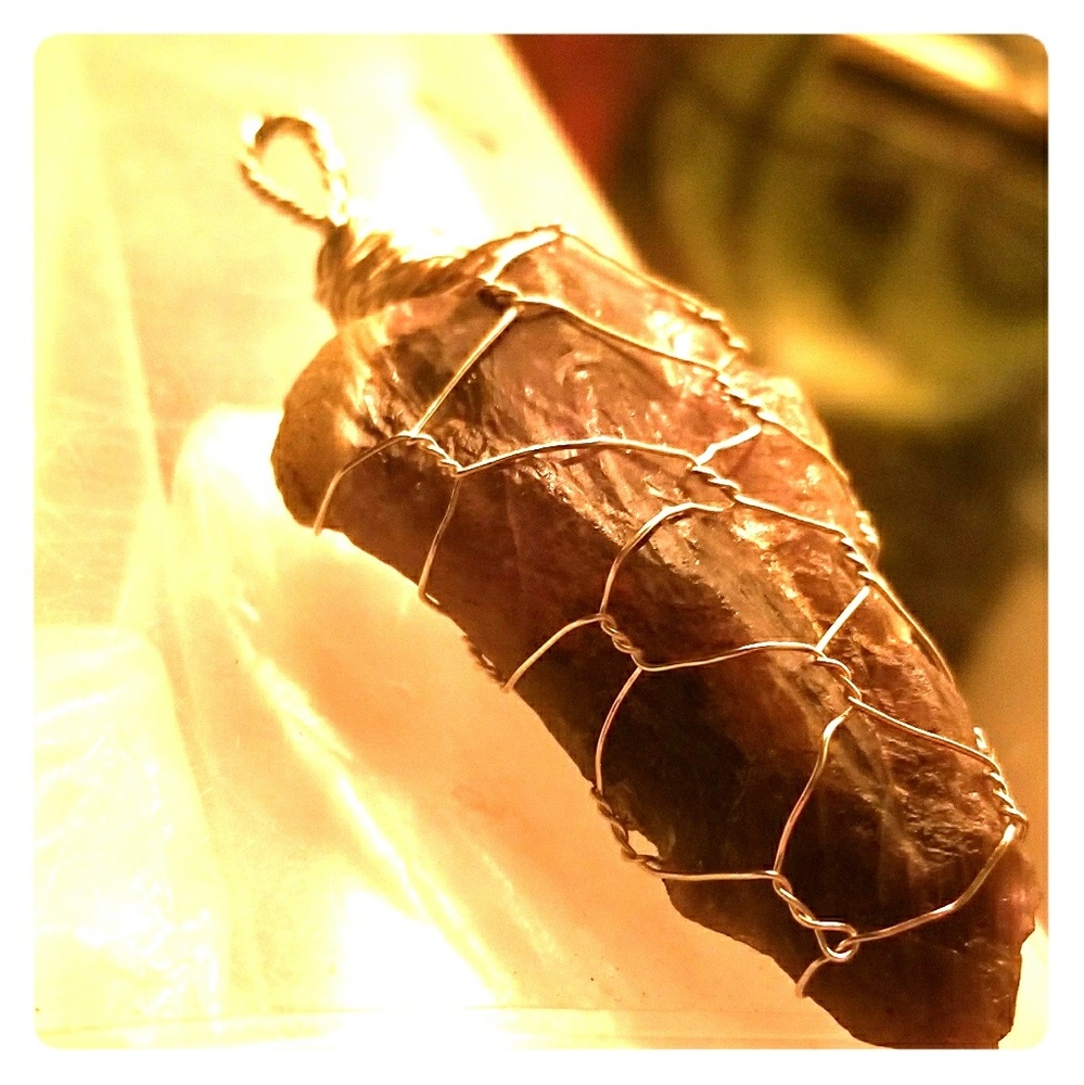 Sterling silver wrapped amethyst pendent